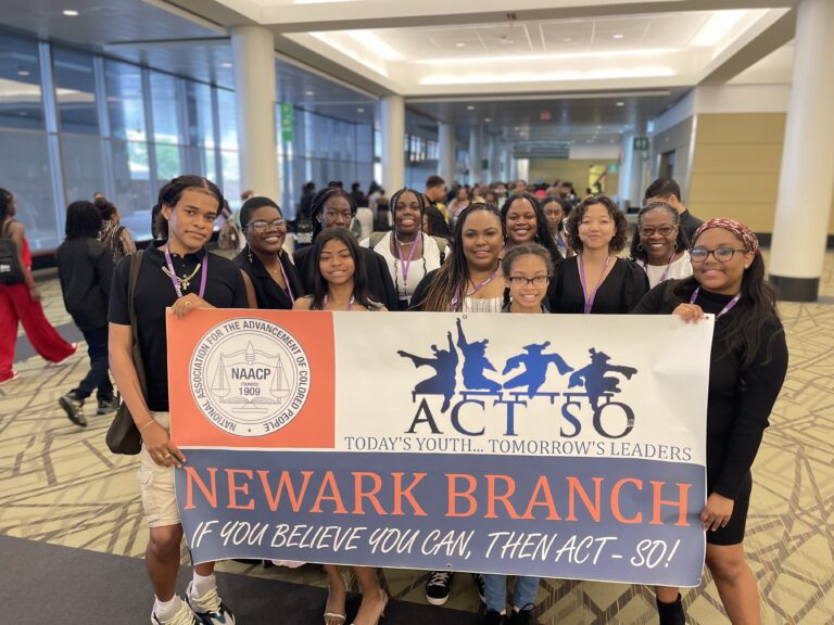 Newark ACTSO Team behind banner